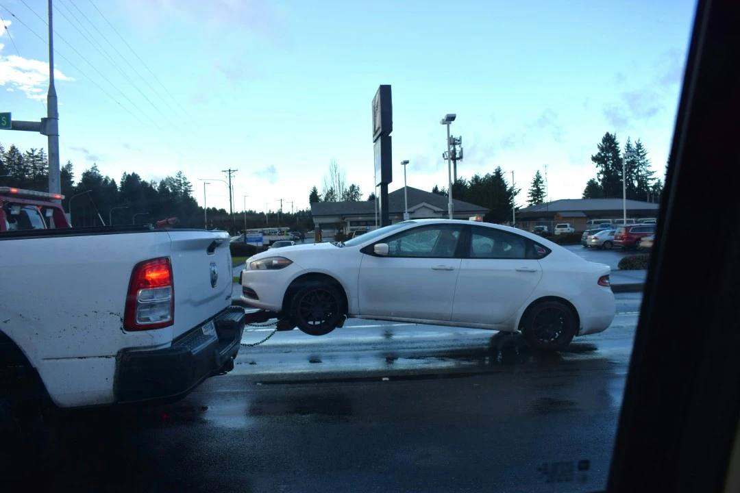 White Truck Towing White Auto